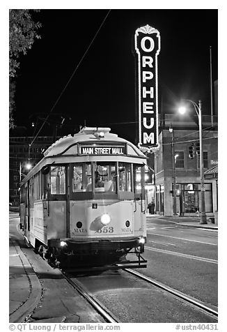 Trolley and Orpheum theater sign by night. Memphis, Tennessee, USA (black and white)