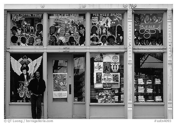 African-American man standing in front of blue storefront on Beal street. Memphis, Tennessee, USA