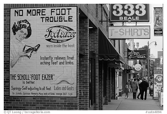 Old advertising on brick building and sidewalk, Beale street. Memphis, Tennessee, USA