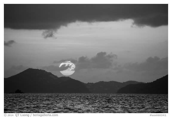 Sun setting over St Thomas island. Saint John, US Virgin Islands (black and white)