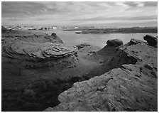 Sandstone swirls and Lake Powell, Glen Canyon National Recreation Area, Arizona. USA (black and white)