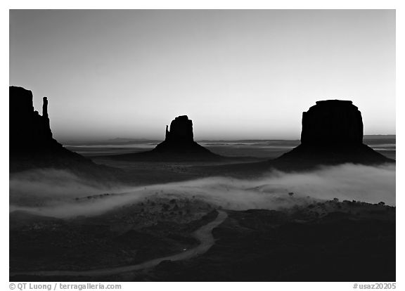 Mittens and fog, sunrise. Monument Valley Tribal Park, Navajo Nation, Arizona and Utah, USA