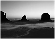 Mittens and fog, sunrise. Monument Valley Tribal Park, Navajo Nation, Arizona and Utah, USA ( black and white)