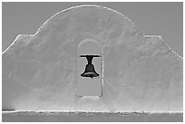 Bell and whitewashed wall, San Xavier del Bac Mission. Tucson, Arizona, USA ( black and white)