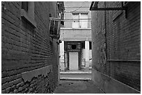 Alley and boarded-up store, Clifton. Arizona, USA ( black and white)