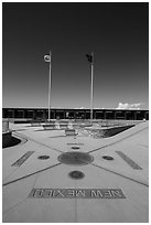 Disks, seals, and flags. Four Corners Monument, Arizona, USA (black and white)