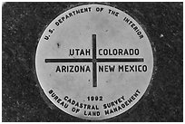 Marker at the exact Four Corners point. Four Corners Monument, Arizona, USA (black and white)