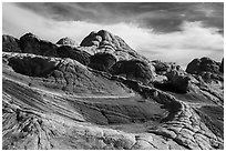 White layer above read layer of twisting sandstone. Vermilion Cliffs National Monument, Arizona, USA ( black and white)