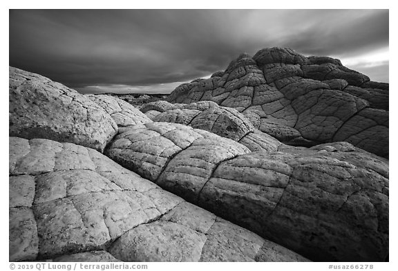 Buttes with crossbeded white sandstone layer, evening. Vermilion Cliffs National Monument, Arizona, USA (black and white)