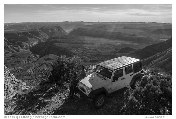 Jeep and visitors on rim edge of Grand Canyon. Grand Canyon-Parashant National Monument, Arizona, USA (black and white)