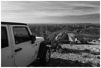 Jeep and tent on Canyon Rim, Twin Point. Parashant National Monument, Arizona, USA ( black and white)