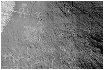 Petroglyph panel with anthropomorphic, zoomorphic, and abstract designs. Vermilion Cliffs National Monument, Arizona, USA ( black and white)