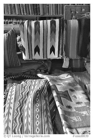 Stacks of varicolored blankets and rugs weaved by Navajo Indians. Hubbell Trading Post National Historical Site, Arizona, USA