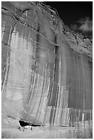 White House Ancestral Pueblan ruins and wall with desert varnish and corner of sky. Canyon de Chelly  National Monument, Arizona, USA (black and white)