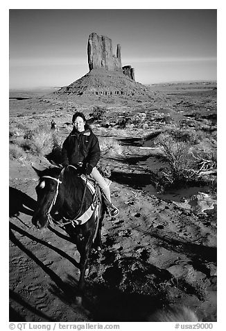 Horseback riding. Monument Valley Tribal Park, Navajo Nation, Arizona and Utah, USA (black and white)