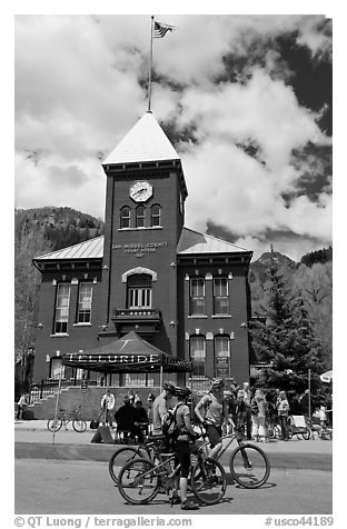 Mountain bikers in front of San Miguel County court house. Telluride, Colorado, USA (black and white)