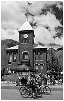Mountain bikers in front of San Miguel County court house. Telluride, Colorado, USA (black and white)