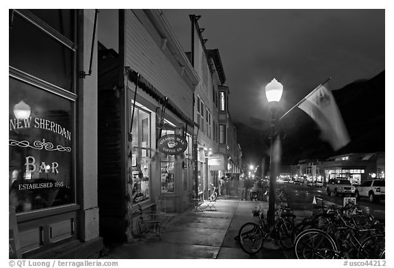 Street with parked bicycles and lamp by night. Telluride, Colorado, USA (black and white)