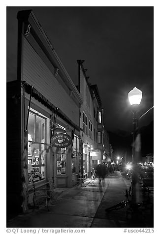 Coffee shop and sidewalk by night. Telluride, Colorado, USA (black and white)