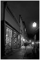 Coffee shop and sidewalk by night. Telluride, Colorado, USA (black and white)
