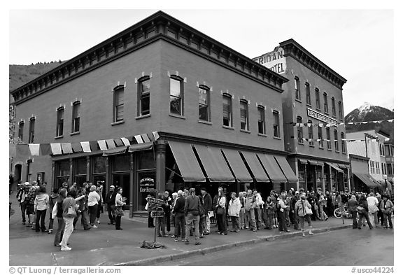 Festival attendees line up on sidewalk. Telluride, Colorado, USA