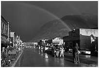 Double rainbow and dark sky over main street. Telluride, Colorado, USA (black and white)