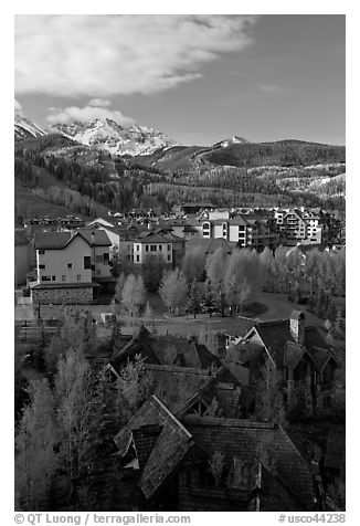 Mountain Village with newly leafed spring trees and snowy peaks. Telluride, Colorado, USA (black and white)