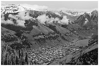 Box canyon surrounded by snowy mountains in spring. Telluride, Colorado, USA (black and white)