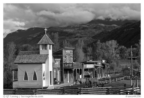 Western-style buildings and horses, Ridgeway. Colorado, USA (black and white)