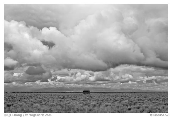 Lonely house on plain under clouds. Colorado, USA