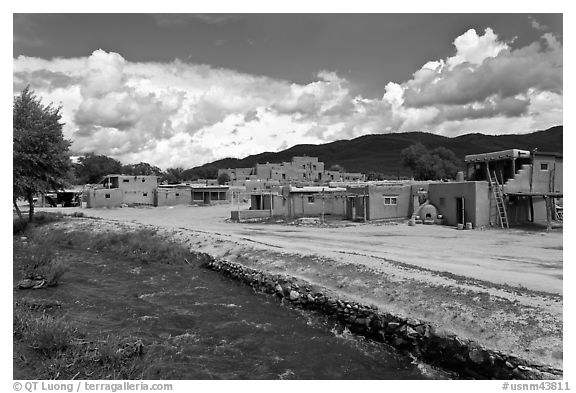 Rio Pueblo stream and pueblo village. Taos, New Mexico, USA (black and white)