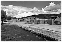 Rio Pueblo stream and pueblo village. Taos, New Mexico, USA (black and white)