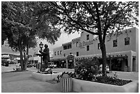 Plazza, statue, and hotel La Fonda. Taos, New Mexico, USA (black and white)