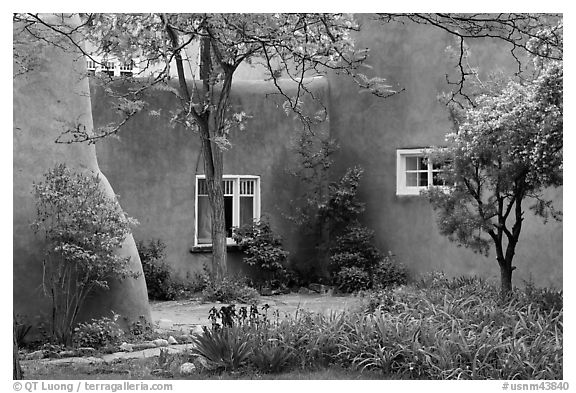 Garden and pueblo revival style building. Taos, New Mexico, USA (black and white)