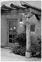 Blue door and window at house entrance. Taos, New Mexico, USA (black and white)