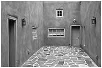 Courtyard and adobe walls. Taos, New Mexico, USA (black and white)