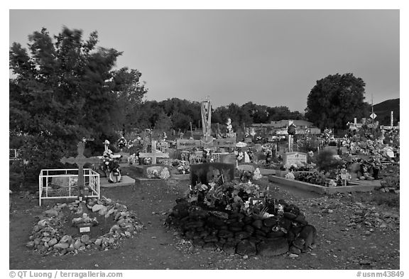 Tomb made of volcanic rocks in cemetery, Rancho de Taos. Taos, New Mexico, USA (black and white)