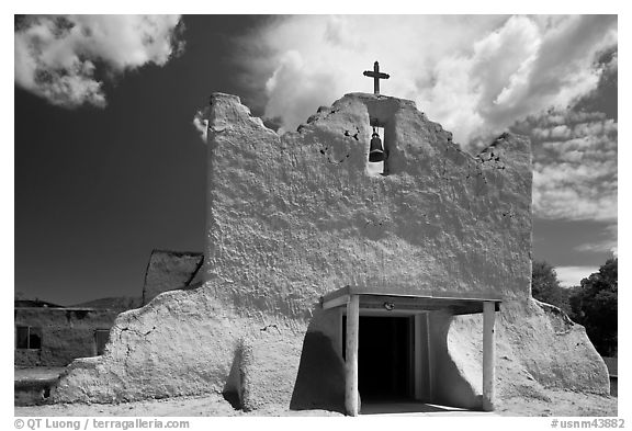 Facade of church covered with tightly compacted earth, clay, and straw, Picuris Pueblo. New Mexico, USA