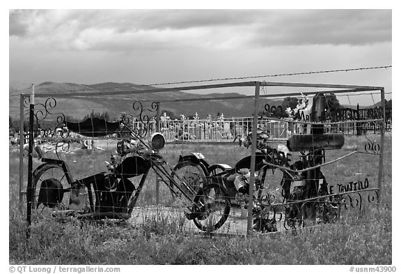 Grave with motorbikes, Truchas. New Mexico, USA (black and white)