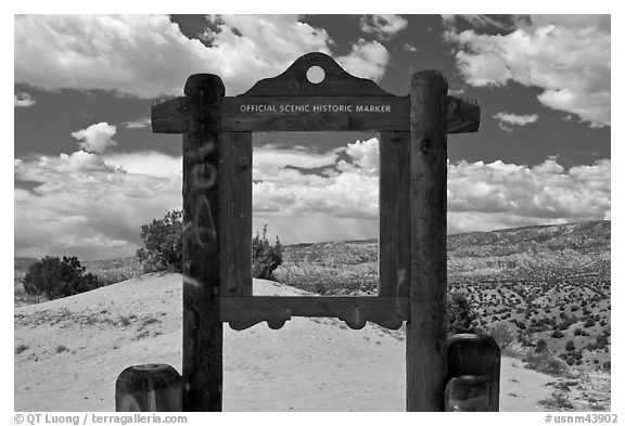 Historic marker framing high desert landscape. New Mexico, USA (black and white)