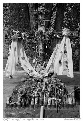 Cross festoned with popular devotion objects, Sanctuario de Chimayo. New Mexico, USA