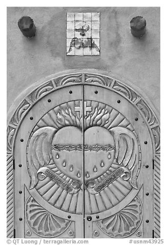 Decorated door, Sanctuario de Chimayo. New Mexico, USA (black and white)