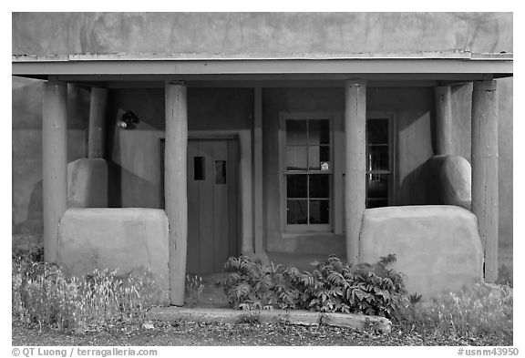 Blue and adobe house porch. Santa Fe, New Mexico, USA (black and white)