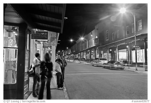 People in historic district by night. Santa Fe, New Mexico, USA (black and white)