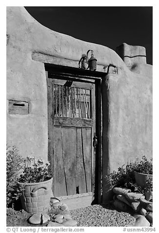 Wooden door and adobe wall. Santa Fe, New Mexico, USA
