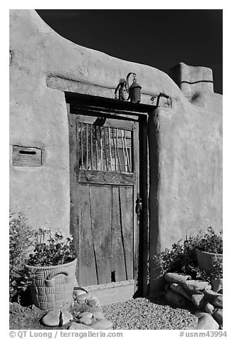 Wooden door and adobe wall. Santa Fe, New Mexico, USA (black and white)