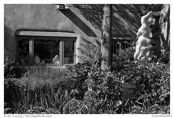 Front yard with sculpture, Canyon Road. Santa Fe, New Mexico, USA (black and white)