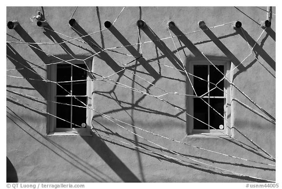 Detail of art installation on facade of adobe building. Santa Fe, New Mexico, USA (black and white)
