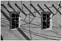Detail of art installation on facade of adobe building. Santa Fe, New Mexico, USA ( black and white)