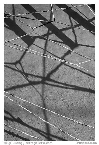 Shadows of vigas (wooden beams) and strings made of plastic bags. Santa Fe, New Mexico, USA